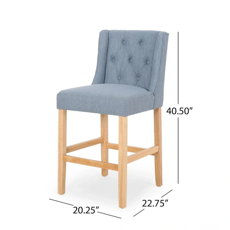 Sgabello da bancone con schienale ad ala, capitonné e gambe in legno di hevea naturale