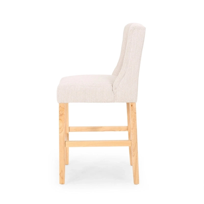 Sgabello da bancone con schienale ad ala, capitonné e gambe in legno di hevea naturale